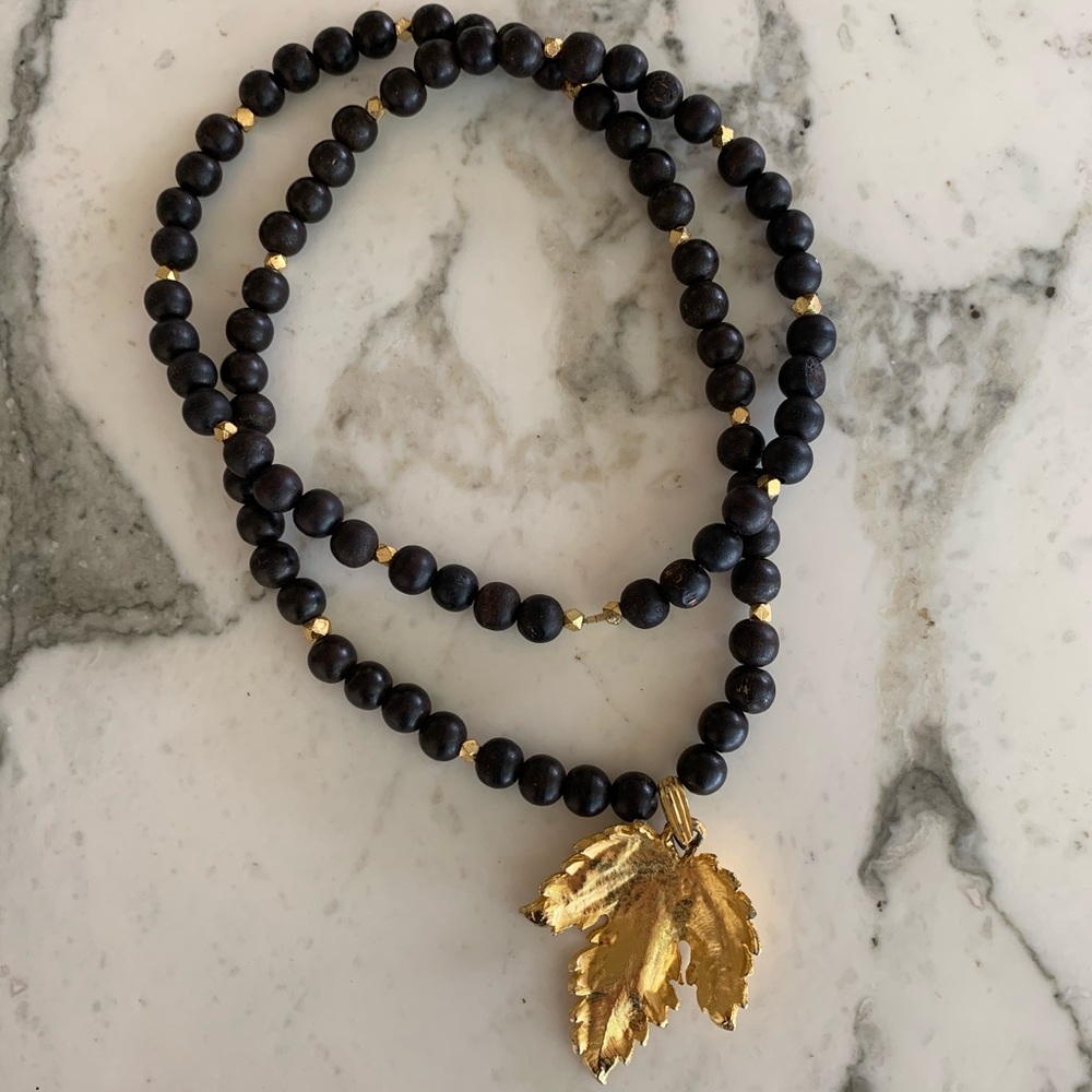 Gold and black leaf necklace